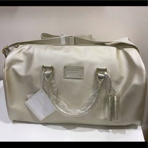 Brand new Michael Kors gold weekender travel bag